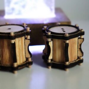 a pair of barewood with crome salt and pepper shakers shaped like drums